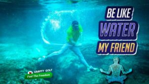 Golfer practicing mindfulness by focusing on a leaf on the course